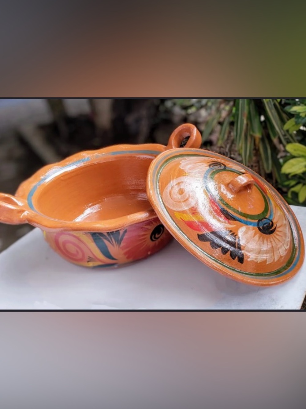 Traditional Mexican clay cazuela casserole dish feat hand-painted designs.